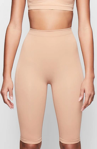 Skims Sculpting Above The Knee Shorts In Ochre