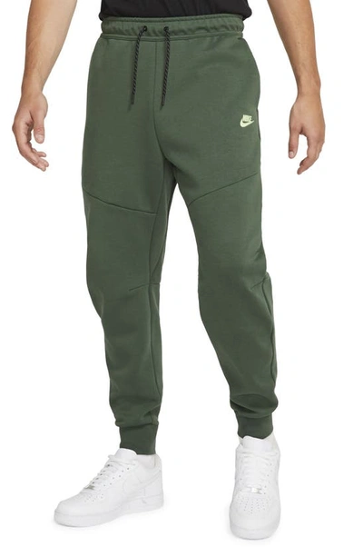 Nike Sportswear Slim Fit Tech Fleece Jogger Pants In Galactic Jade/light Lime