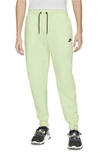 Nike Sportswear Slim Fit Tech Fleece Jogger Pants In Light Liquid Lime/black