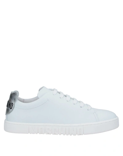 Moschino Logo Embossed Sneaker In White Silver