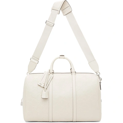 Gucci White Gg Embossed Duffle Bag In White Leather