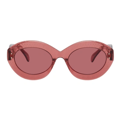 Alaïa Pink Oversized Cat Eye Sunglasses In 006 Pink