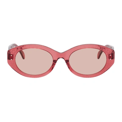 Alaïa Pink Round Cat Eye Sunglasses In 005 Pink