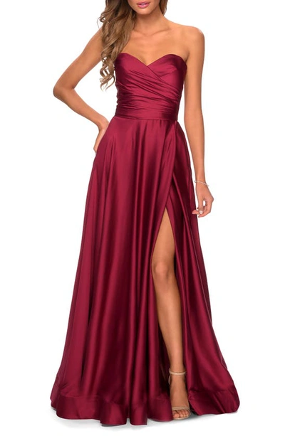 La Femme Pleated Bodice Strapless Satin Gown In Wine