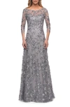 La Femme Lace Gown With Full Skirt And Sheer Lace Sleeves In Grey