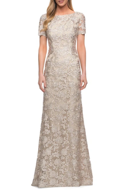 La Femme Lace Short Sleeve Sheath Gown In Champagne