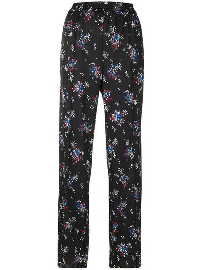 Msgm Floral Printed Techno Jersey Pants In Black
