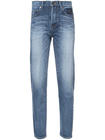 Saint Laurent Distressed Tapered Fit Jeans In Blue