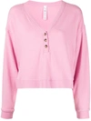 Alo Yoga Alolux Soho Cropped Henley Top In Parisian Pink