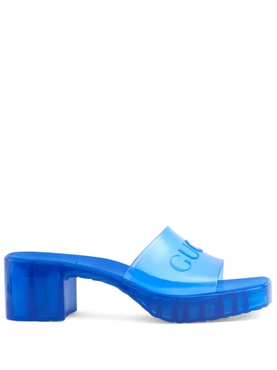 Gucci Embossed Logo Slide Sandals In Blue Rubber