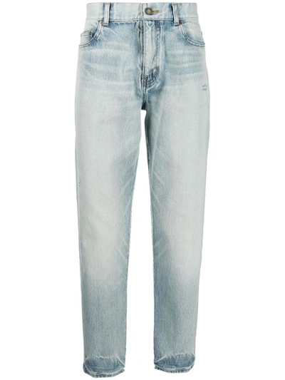 Saint Laurent Slim-fit Tapered Distressed Denim Jeans In Light Wash