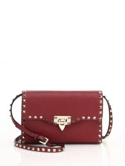 Valentino Garavani Rockstud Medium Leather Crossbody Bag In Dark Red