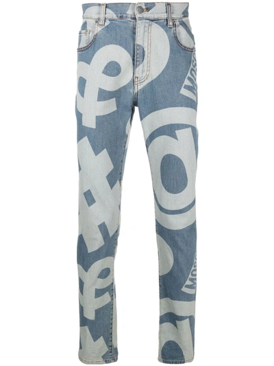 Moschino Allover Symbols Stretch Denim Trousers In Blue