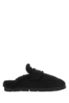 Prada Triangle Logo-plaque Shearling Backless Loafer In Black