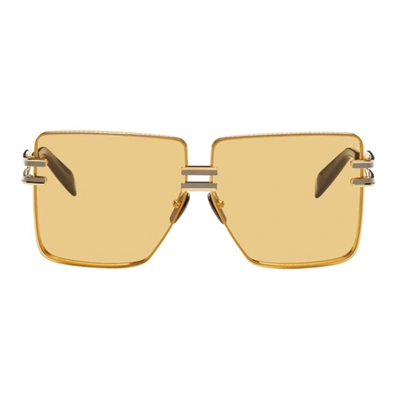 Balmain Gendarme Gold And Amber Unisex Sunglasses In Gld/blk