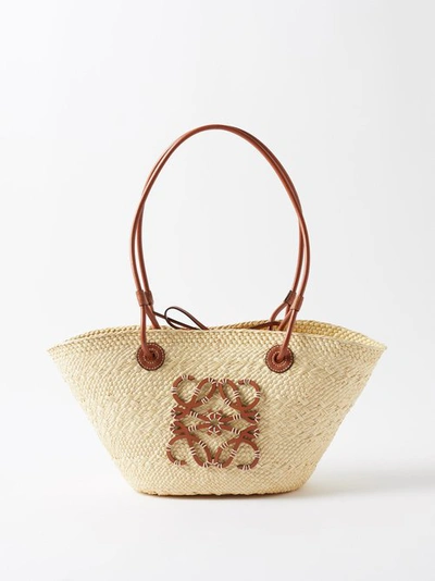Loewe X Paula's Ibiza Anagram Small Basket Bag In Iraca Palm With Leather Handles In Natural Tan