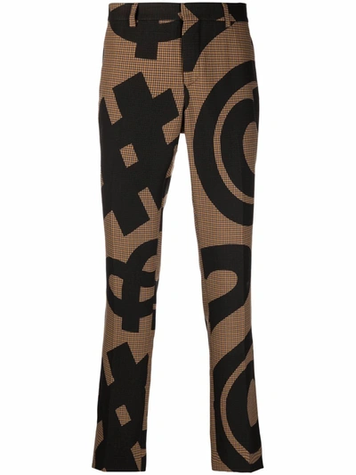 Moschino Graphic-print Pressed-crease Trousers In Brown