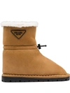 Prada Shearling-lined Logo Plaque Ankle Boots In Brown