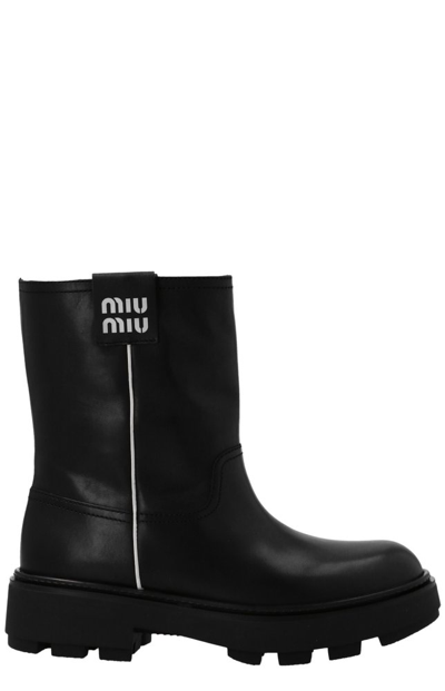 Miu Miu Classic Logo Patched Boots In Black