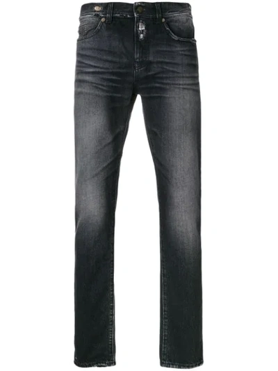 Saint Laurent Distressed Trim Slim Fit Jeans In Black
