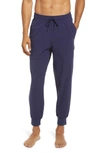 Alo Yoga Co-op Water Repellent Pocket 7/8 Joggers In True Navy