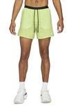 Nike Frame Pleated Belted Leather Shorts In Light Lemon Twist