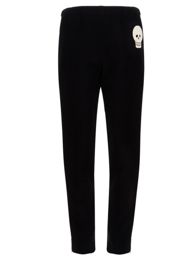 Alexander Mcqueen Jogging Pants With Embroidered Skull In Black