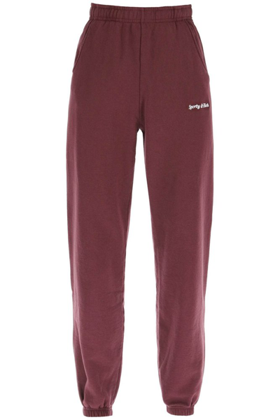 Sporty And Rich Logo-embroidered Tapered-leg High-rise Cotton-blend Jogging Bottoms In Red