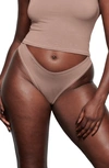 Skims Stretch Cotton Dipped Thong In Umber
