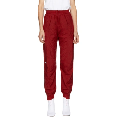 Vetements + Reebok Distressed Embroidered Shell Track Pants In Red