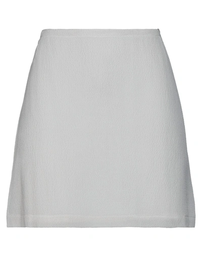 Maison Cléo Mini Skirts In White