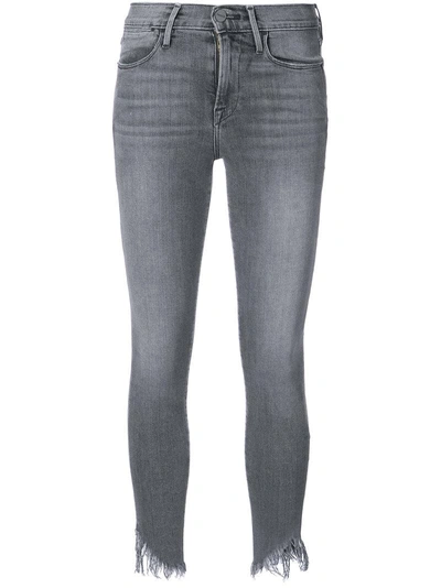 Frame Shredded Hem Jeans In Grey