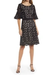 Shani Laser Cut Floral High-low Cocktail Dress In Black Nude