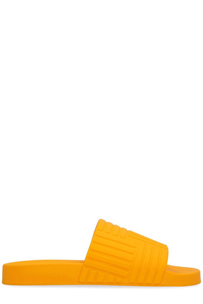 Bottega Veneta Carpet Embossed Rubber Slides In Yellow & Orange