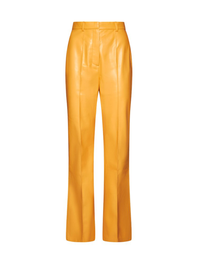 Nanushka Faux-leather Flared Trousers In Orange