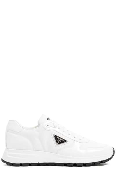 Prada Logo Plaque Perforated Sneakers In White/black