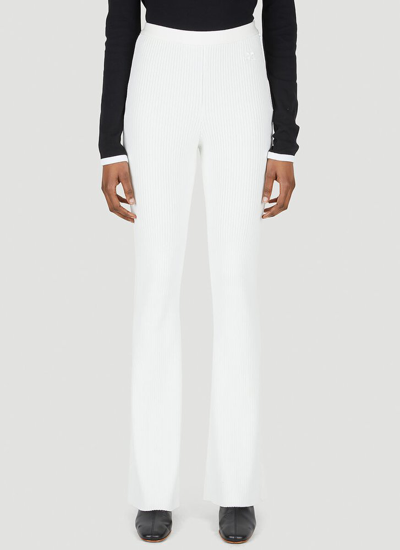 Courrèges Ribbed High-waisted Flared Leg Trousers In White