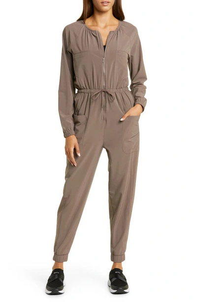 Zella Getaway Long Sleeve Zip-up Jumpsuit In Tan Dusk