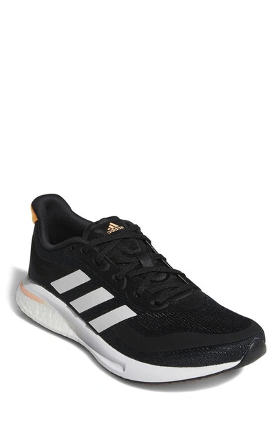 Adidas Originals Supernova Running Shoe In Black/ White/orange