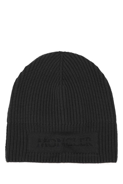 Moncler Logo-embroidered Ribbed-wool Beanie Hat In Black