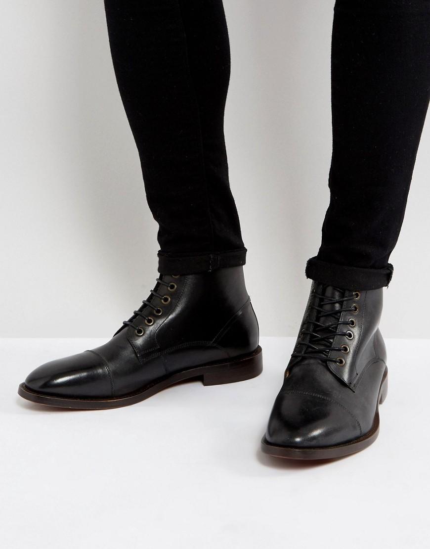 h by hudson battle lace up boots in black leather