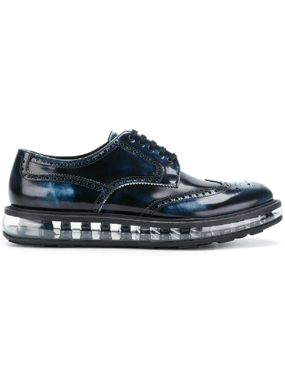 Prada Levitate Burnished-leather Wingtip Brogues In Blue