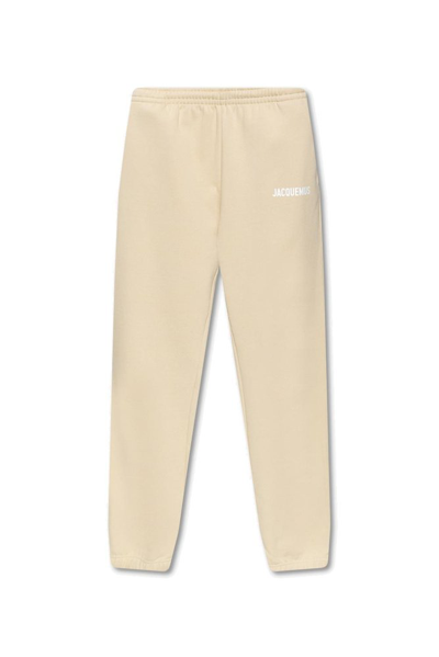 Jacquemus Logo-print Organic Cotton-jersey Track Trousers In Beige