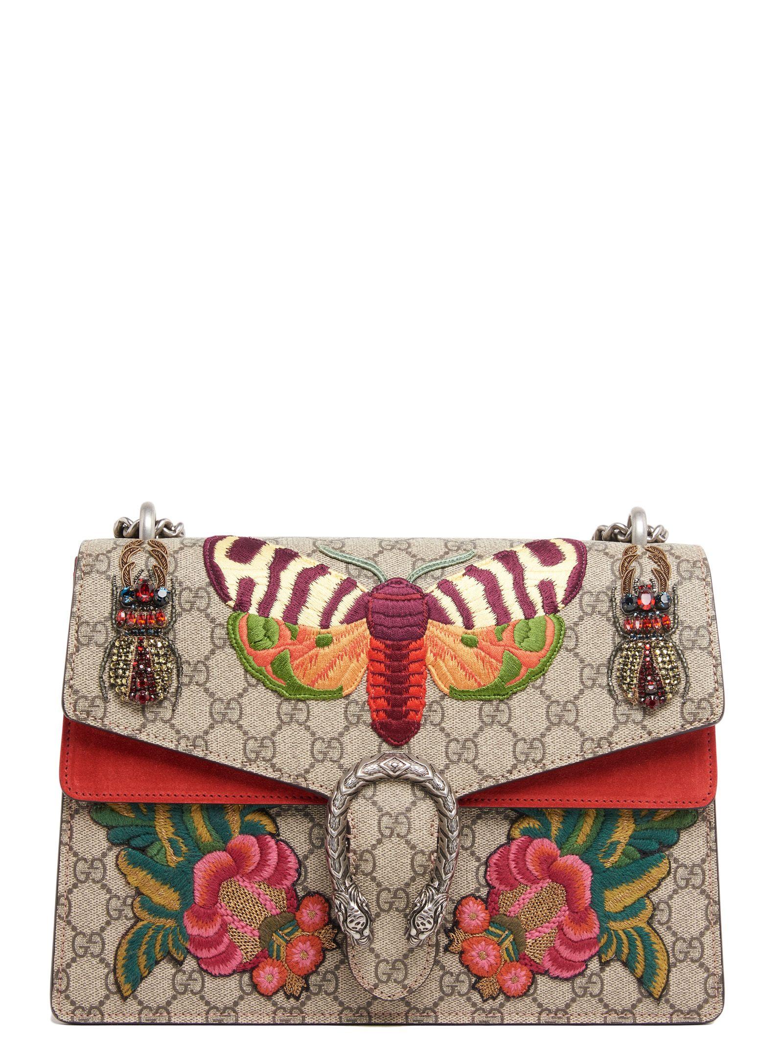 white gucci purse with heart on back