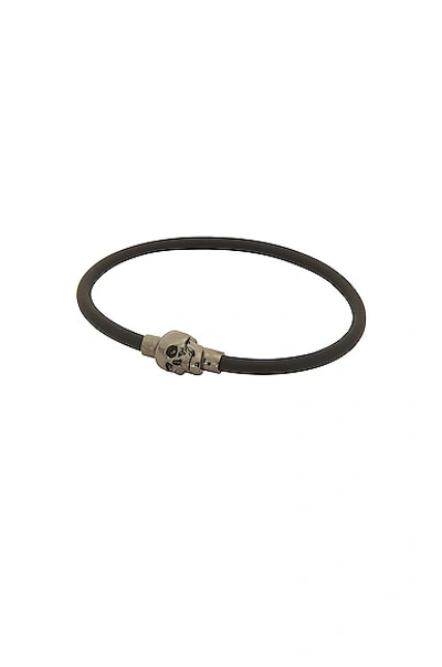 Alexander Mcqueen Rubber Cord Skull Bracelet In Black,silver