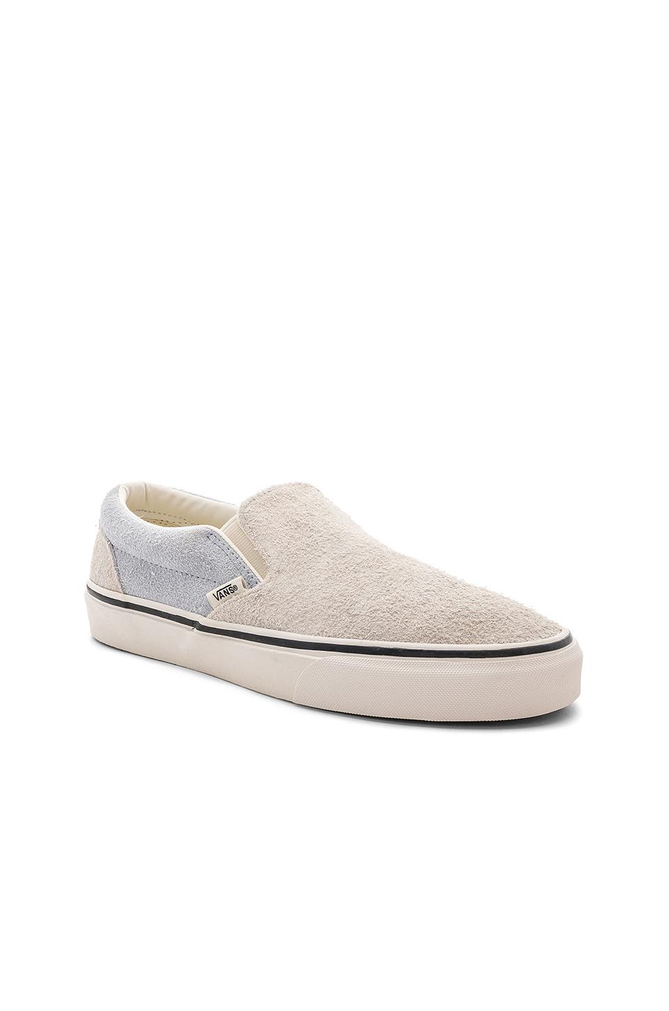 fuzzy vans slip on