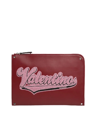 Valentino Garavani Logo Leather Clutch In Rosso