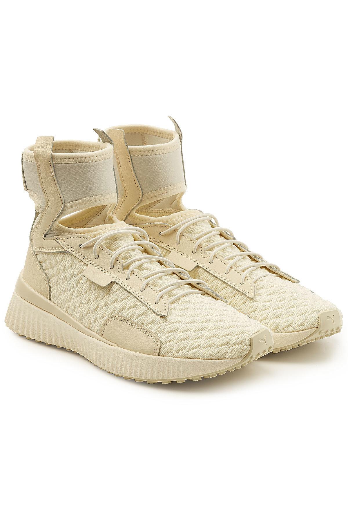 tan puma high tops