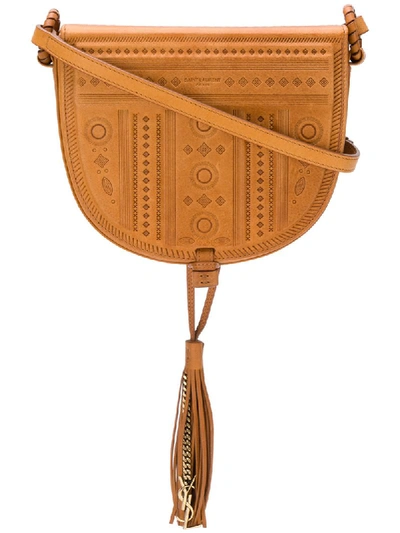 Saint Laurent Decorative Embossed Saddle Bag In Brown