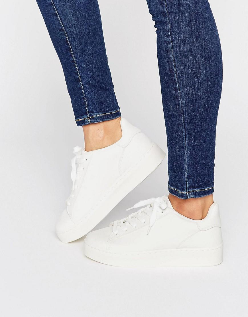 white leather look trainers
